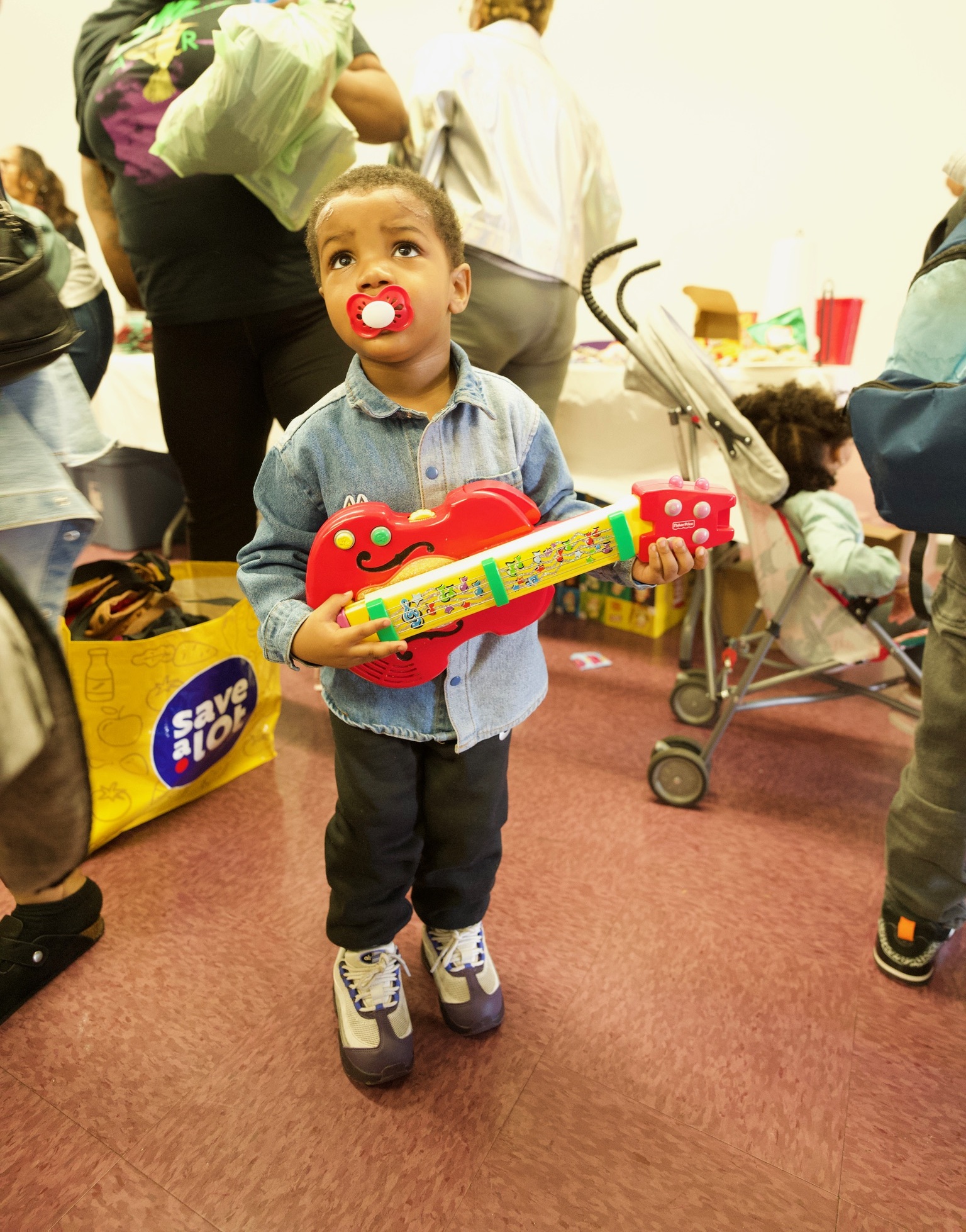 Child at a DJ's Care Village community event